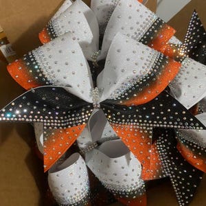 rhinestone cheer bow- ombre orange and black and white with AB Rhinestones