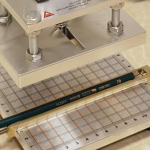 A professional pencil press machine Pencil holder on machine Pencil foils Custom pencil letters Pencil jig
