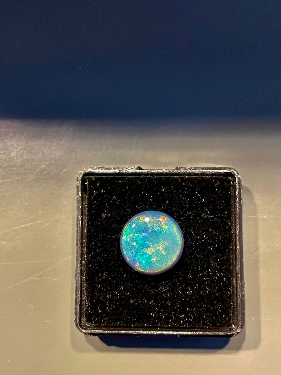 Semi- Black Opal; 11 mm rd. Natural Australian sol