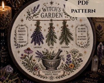 May include: A round embroidery hoop featuring a "Witch's Garden" design. The design includes embroidered lavender, sage, and rosemary, along with a mortar and pestle. Text includes "Plant Magick", "Cultivate Intention", and "Harvest Magic".