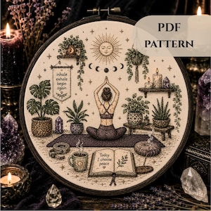 May include: An embroidery hoop featuring a person meditating on a mat, surrounded by plants, crystals, and candles. Text reads: inhale exhale begin again and Today I choose peace. The design includes a sun, moon phases, and a book.