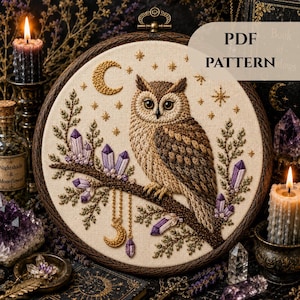 May include: A detailed embroidery hoop art piece featuring a brown owl perched on a branch with purple crystals. The design includes a crescent moon, stars, and the text "PDF PATTERN". The artwork is set against a cream-colored fabric.