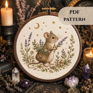 May include: An embroidered hoop art piece with a detailed design of a mouse holding flowers. The design includes lavender, daisies, and a crescent moon. The text "PDF PATTERN" is displayed on the right side. The hoop is set against a dark, atmospheric background.