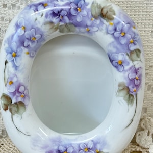 Porcelain picture frame hand painted multiple violets oval 4 x 3 1/2 outside measure