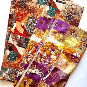 May include: Two pieces of fabric with a patchwork design. The fabric is a mix of brown, gold, purple, and green colors. The fabric features a variety of patterns, including peacocks, flowers, and geometric shapes.
