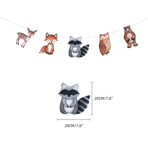 May include: A woodland animal garland featuring a deer, fox, raccoon, owl, and bear. Each animal is illustrated in a cartoon style against a white background. The garland is 20 cm long.