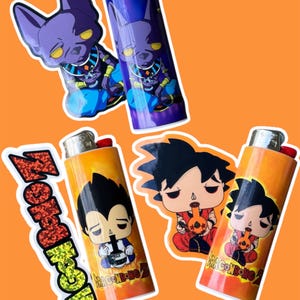 May include: Four lighters with cartoon character designs on an orange background. Two lighters feature a purple cat-like character. The other two lighters have anime characters with the text "DRAGONBONG" and "DRAGON BONG Z".