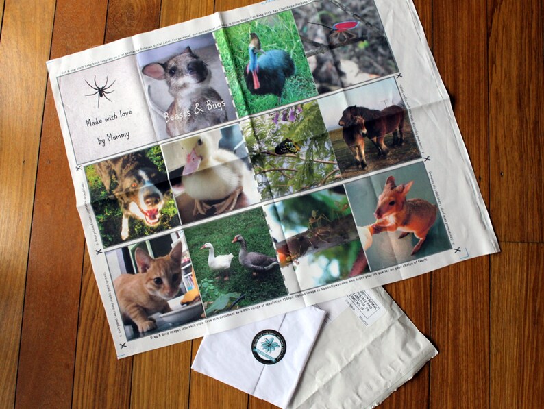 May include: A white fabric with a collage of images of animals and insects. The fabric has the text "Made with love by Mummy" and "Beasts & Bugs" printed on it.