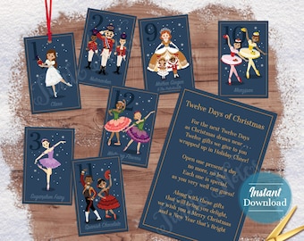 May include: Twelve Days of Christmas printable gift tags featuring illustrations of characters from the Nutcracker ballet. Each tag has a number from 1 to 12 and a corresponding character name. The tags are on a blue background with gold accents.
