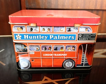 Boîte à biscuits Huntley & Palmer. Conception d'autobus de Londres. Des publicités des années 50 sur tous les côtés.