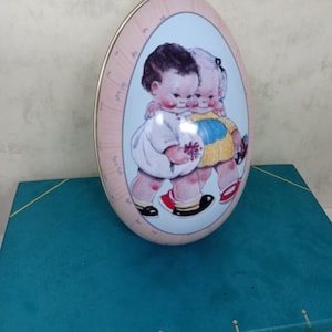 Mabel Lucie Attwell Egg Shaped Tin. Official Reproduction of 1930s design. Armstrong and Claydon.