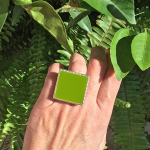 Lime green big square ring, made of resin, with a hammered silver band. Make a statement with this fresh and bold olive green ring
