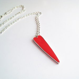 Ruby red heart statement necklace, made of resin, with a silver tone base. Show your love with this perfect anniversary gift!