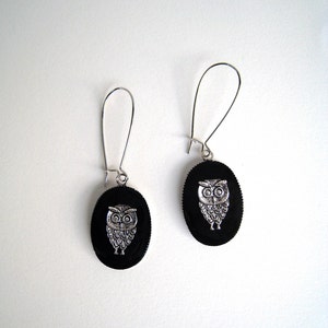 Owls in black oval dangle earrings, made of resin, very lightweight. The holy bird of Greek Goddess Athena, the symbol of wisdom