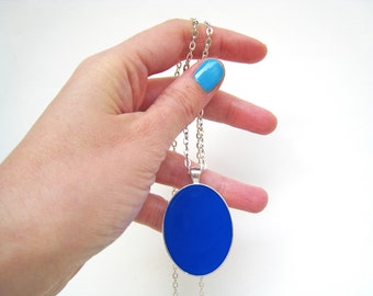 Lapis blue big oval silver-tone pendant necklace, made of resin. Monochrome & minimal, makes a statement with its beautiful blue color