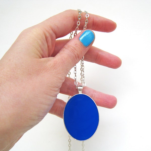 Lapis blue big oval silver-tone pendant necklace, made of resin. Monochrome & minimal, makes a statement with its beautiful blue color