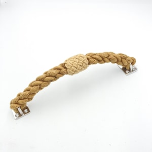 May include: A brown rope handrail with a knotted rope handle and silver metal mounting brackets.