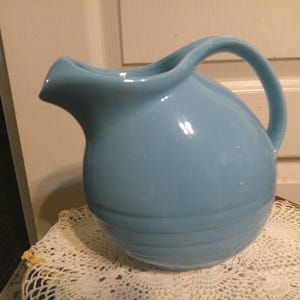Blue Hull Tilt Ball Pitcher