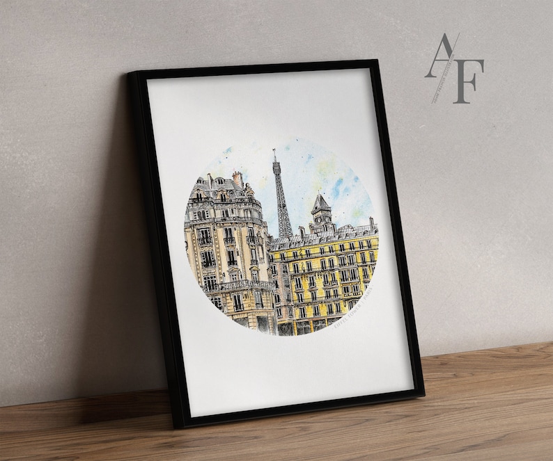 May include: A watercolor painting of a Parisian cityscape with the Eiffel Tower in the background. The painting is framed in a black frame and has a white background.