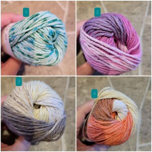 May include: Four balls of yarn in different color combinations. The first ball is green and blue, the second is purple and pink, the third is gray and cream, and the fourth is orange and brown.