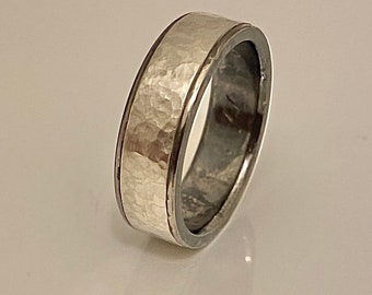 Titanium ring with hammered sterling silver inlay