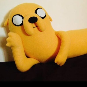 May include: A set of three ceramic nesting bowls in graduating sizes. The bowls feature a speckled, matte finish in shades of cream, light brown, and dark brown. The largest bowl is approximately 7 inches in diameter.