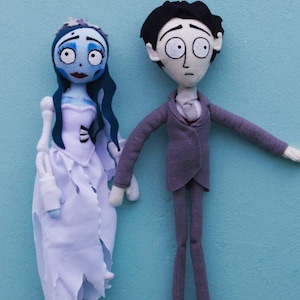 May include: A set of three ceramic mugs with a speckled, matte finish. The mugs are in shades of cream, light gray, and dark gray. Each mug has a simple, minimalist design, perfect for coffee or tea.