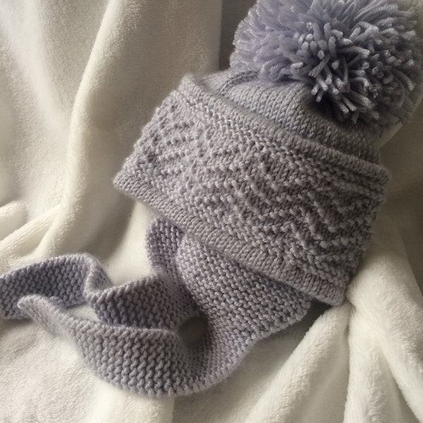 Knitting pattern 67 pdf personal downloaded file to knit a baby girls or baby boys trapper hat earflap hat from birth to 12 months.