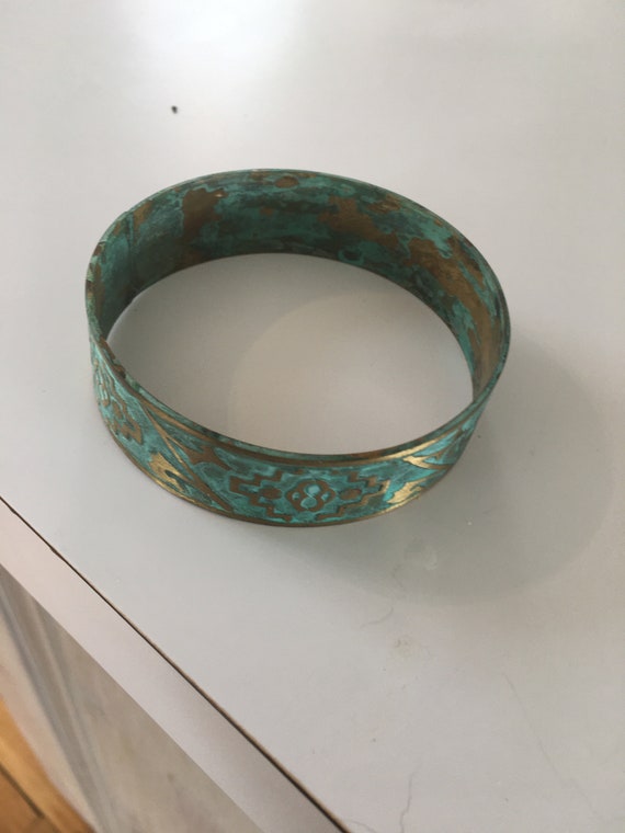 Brass bangle bracelet with Indian symbols