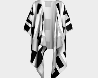 May include: A black and white geometric patterned kimono with a long, flowing design. The kimono has a V-neck and short sleeves.
