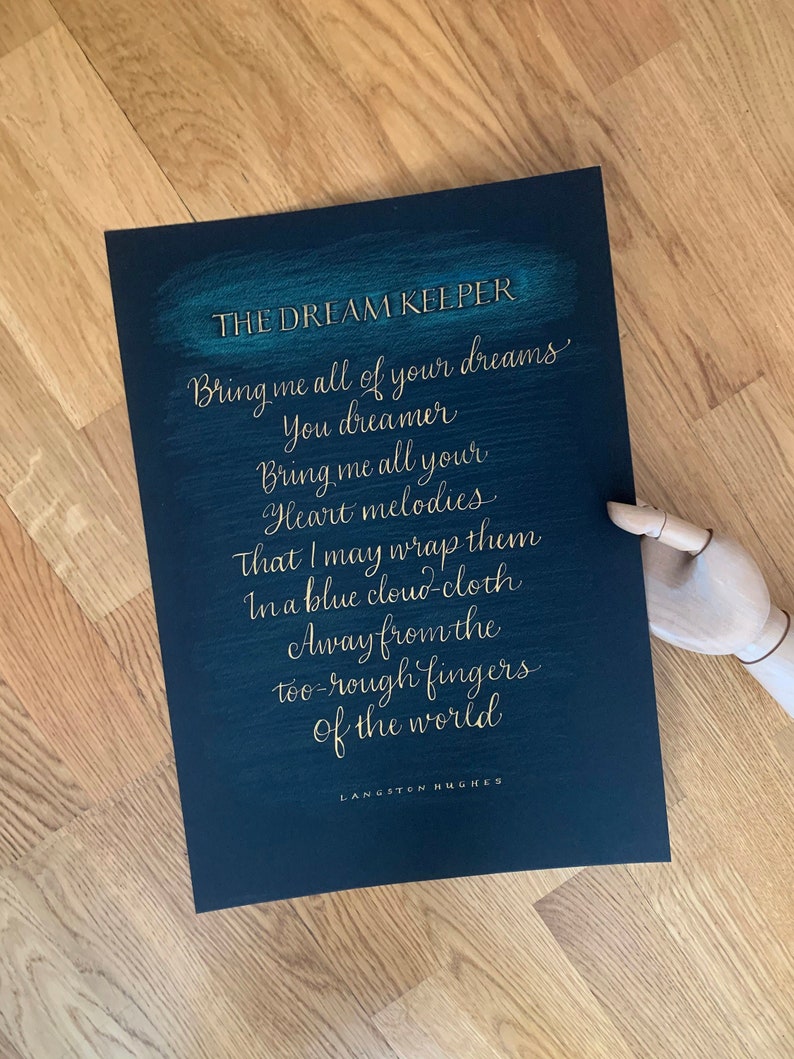 May include: A black and teal poster with gold lettering that reads "THE DREAM KEEPER" and a poem by Langston Hughes: "Bring me all of your dreams You dreamer Bring me all your Heart melodies That I may wrap them In a blue cloud-cloth Away from the too-rough fingers of the world"