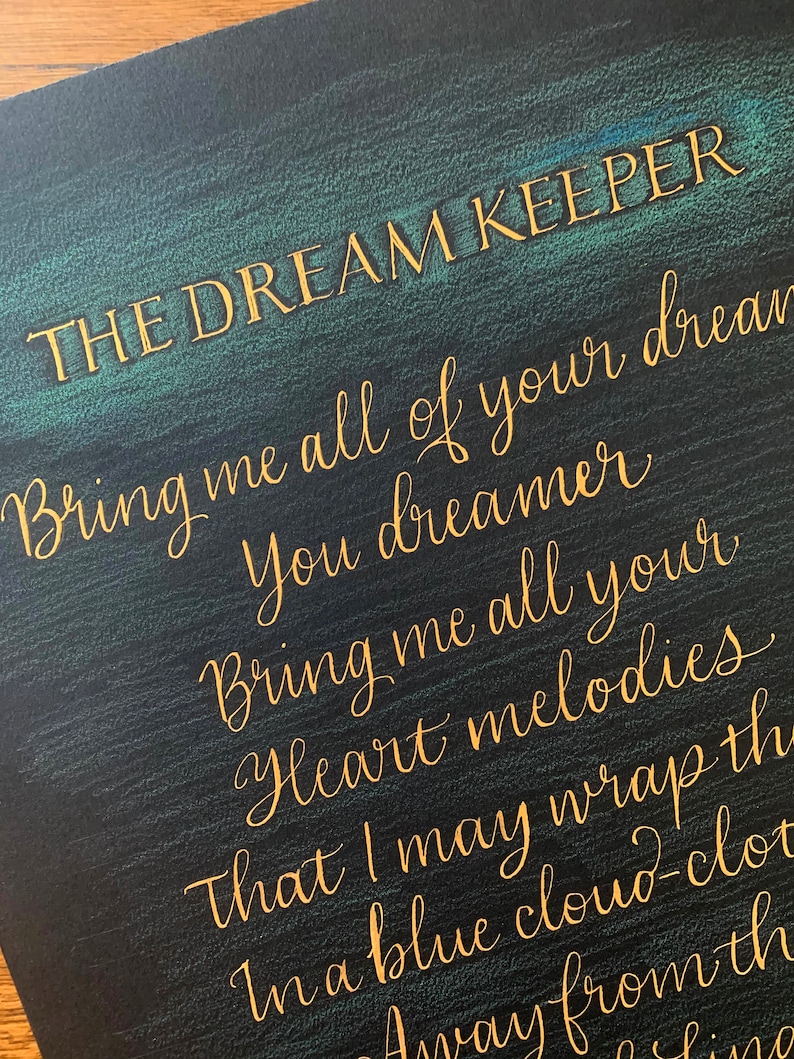 May include: A black background with gold lettering that reads "THE DREAM KEEPER" and a poem that reads "Bring me all of your dreams, You dreamer, Bring me all your heart melodies, That I may wrap them in a blue cloud-cloth, Away from the"