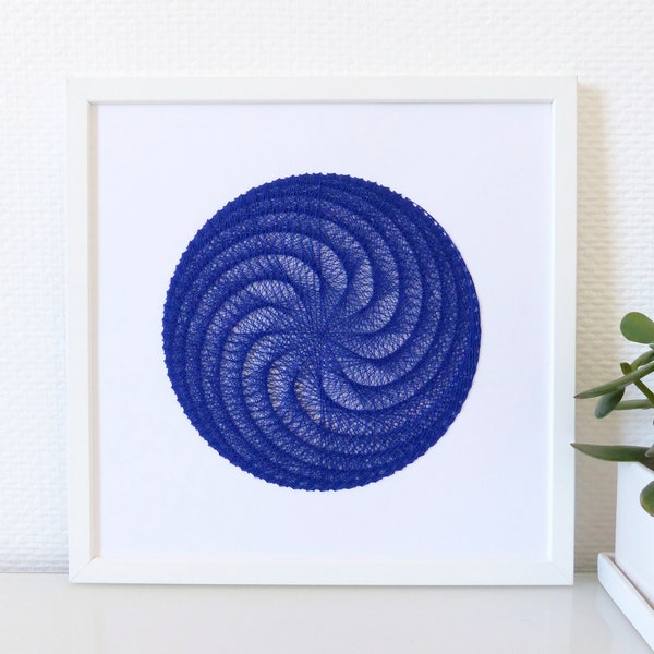 Hand embroidered paper tableau sapphire blue crossed threads rosette pattern.contemporary embroidery.textile design.graphic art.modern decor