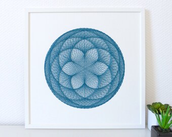 Hand embroidered paper tableau peacock blue crossed threads rosette design