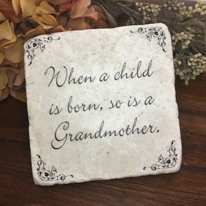 Grandparent gift.  When a Child is Born, so is a Grandmother. Tumbled marble keepsake quote on plaque.