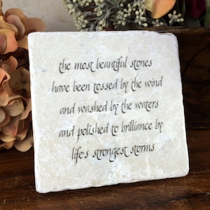 The most beautiful stones have been tossed by the wind... inspirational quote on tumbled marble plaque.  Gift of encouragement and support.