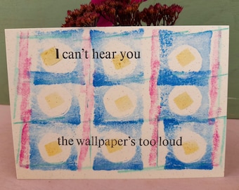 Humorous postcard. I can't hear you the wallpaper's too loud. Letterpress print.