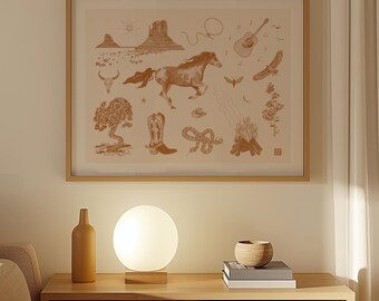 May include: A framed print with a brown background featuring a variety of illustrations, including a horse, a cowboy boot, a snake, a guitar, a cactus, and a mountain range. The print is displayed on a wall above a wooden table with a lamp and a bowl.