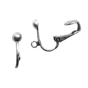 May include: Two silver-toned clip-on earring findings. Each finding has a small, round ball at the top, a slender stem, and a hinged clip. The clip has a ridged surface for secure attachment. These findings are designed for creating clip-on earrings.