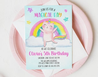May include: A blue and white birthday invitation featuring a rainbow and a unicorn cat. The text reads "Join us for a magical day as we celebrate Olivia's 5th Birthday. Saturday, June 15th at 3:00 PM. The Williams Residence, 798 West Main Street, Easton. RSVP to Jenny at 646-043-2395."