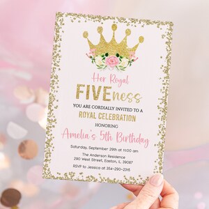 May include: A gold glitter birthday invitation with a pink and gold crown and floral accents. The text reads "Her Royal Fiveness You Are Cordially Invited To A Royal Celebration Honoring Amelia's 5th Birthday Saturday, September 29th at 10:00 am The Anderson Residence 290 West Street, Easton, IL 39087 RSVP to Jessica at 354-290-2315"