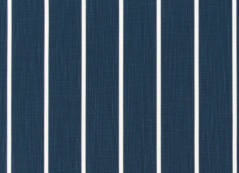 May include: A blue and white striped fabric with a textured surface.