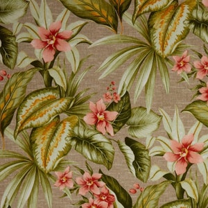 May include: A fabric with a tropical floral pattern. The design features large green leaves with yellow and orange accents, and pink flowers. The background is a neutral tan color, creating a vibrant and natural look.
