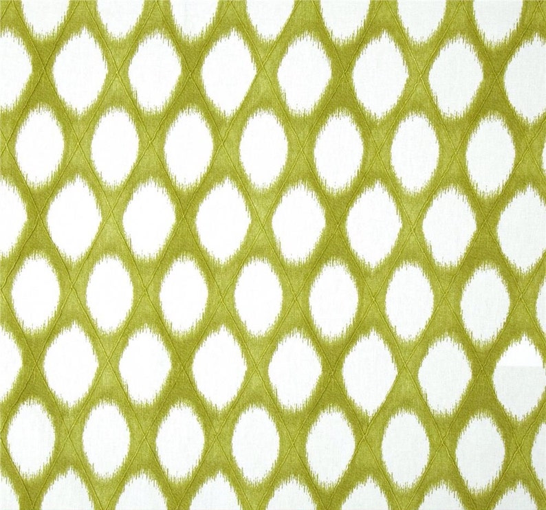 May include: White fabric with a green ikat pattern of overlapping circles.