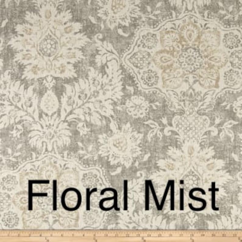 May include: Floral fabric with a large-scale floral pattern in shades of gray, cream, and tan. The design features stylized flowers and foliage, with the text "Floral Mist" at the bottom.