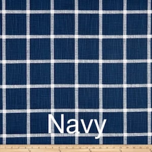 May include: Navy blue fabric with a white checkered pattern. The fabric has a textured surface.