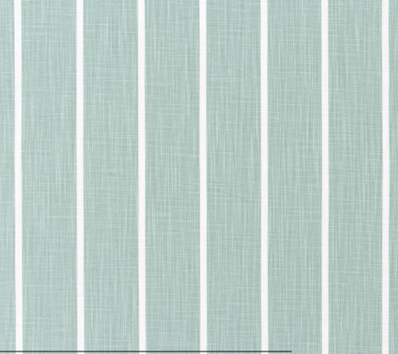 May include: A light blue fabric with white vertical stripes. The fabric has a subtle textured pattern.