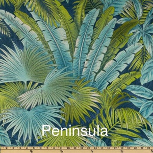 May include: A tropical-themed fabric with a blue and green color scheme. The fabric features a repeating pattern of palm leaves and other tropical foliage. The fabric is called "Peninsula".
