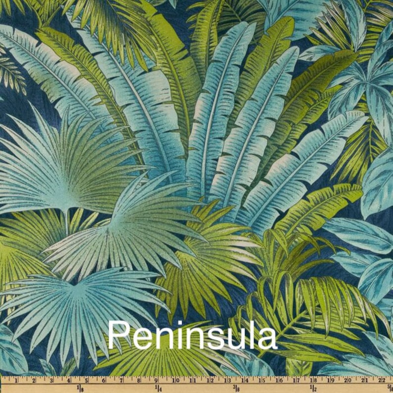 May include: A tropical-themed fabric with a blue and green color scheme. The fabric features a repeating pattern of palm leaves and other tropical foliage. The fabric is called "Peninsula".