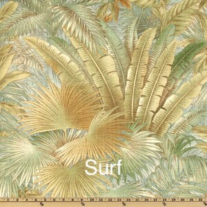 May include: A tropical-themed fabric with a repeating pattern of palm leaves in shades of green, brown, and beige. The fabric has the word "Surf" printed on it.